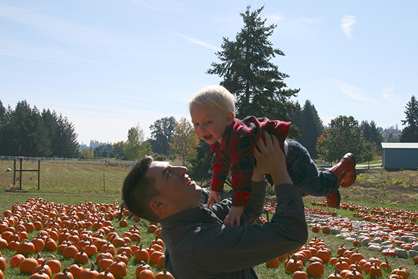 Family Photo Editing clackamas Pumpkin patch Dad holding son Color and lighting fixed