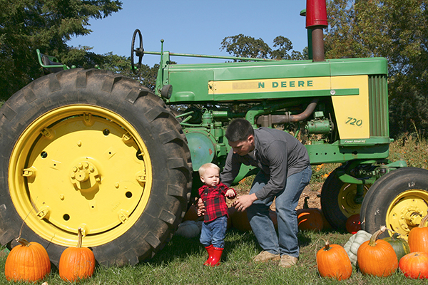 Family Photography clackamas Pumpkin tractor father and son